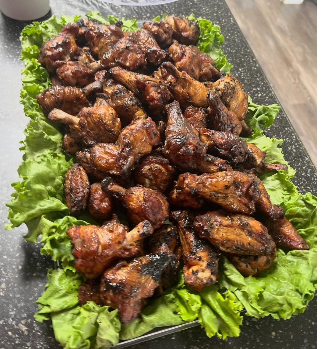 Platter of smoked chicken wings on lettuce
